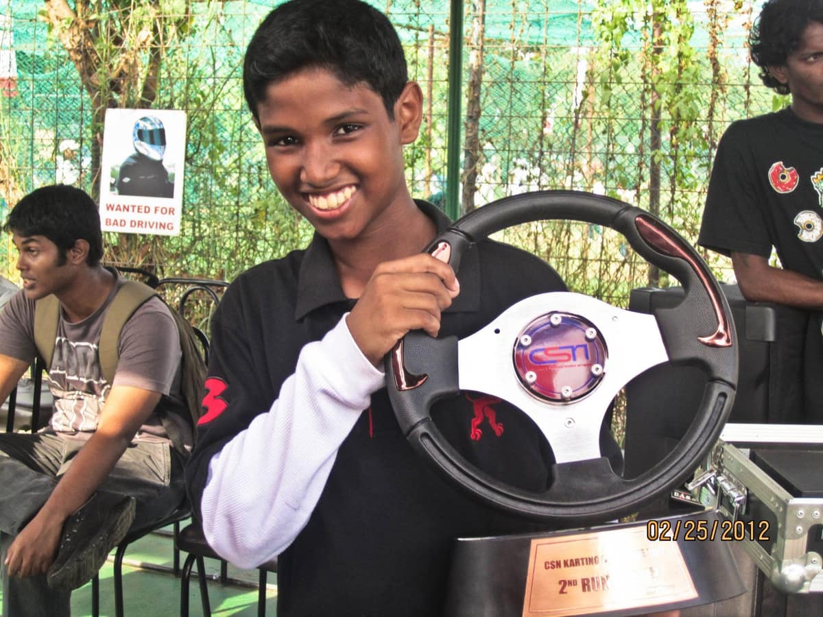 First podium, holding a trophy